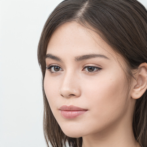 Neutral white young-adult female with long  brown hair and brown eyes