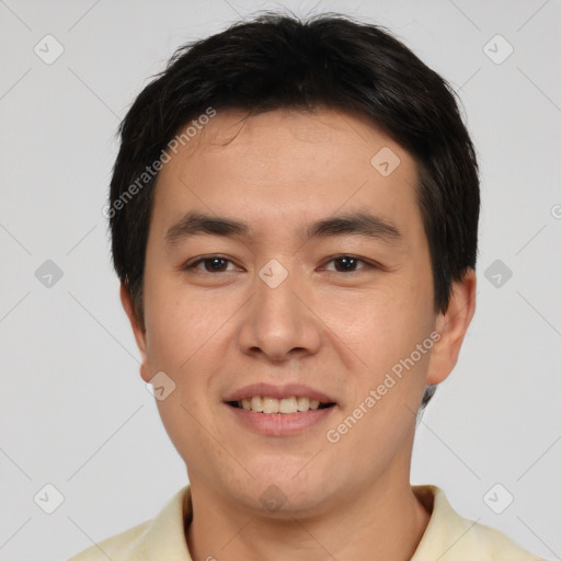 Joyful white young-adult male with short  black hair and brown eyes