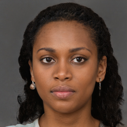 Neutral black young-adult female with long  black hair and brown eyes