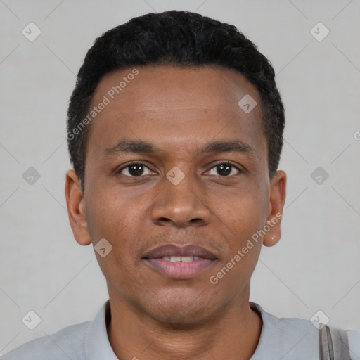 Joyful black young-adult male with short  black hair and brown eyes