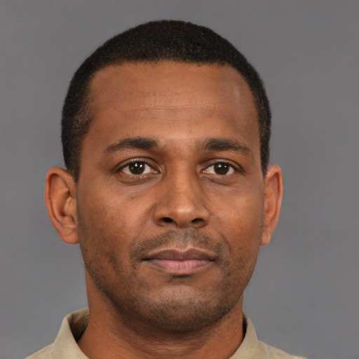 Neutral latino young-adult male with short  brown hair and brown eyes