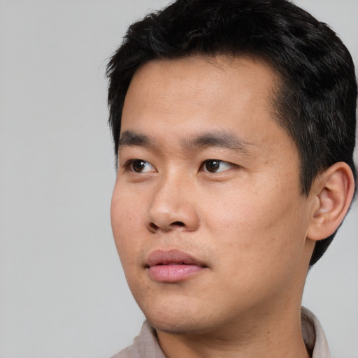 Neutral asian young-adult male with short  black hair and brown eyes