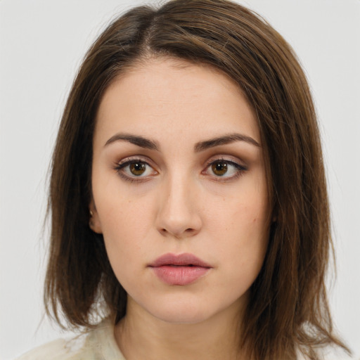 Neutral white young-adult female with medium  brown hair and brown eyes