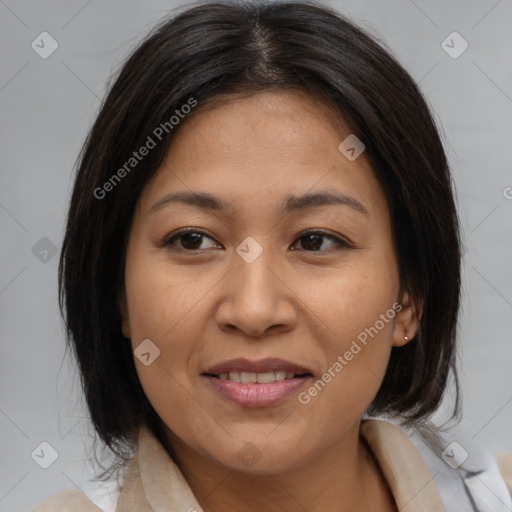 Joyful asian young-adult female with medium  brown hair and brown eyes