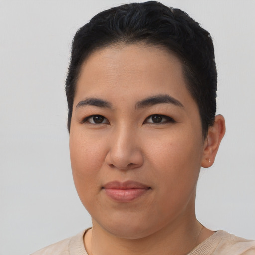 Joyful asian young-adult female with short  black hair and brown eyes