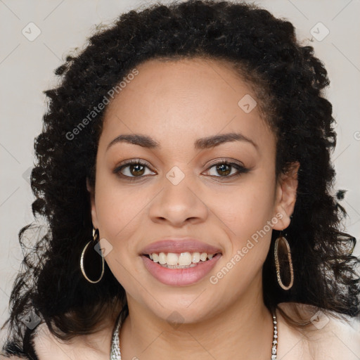 Joyful black young-adult female with long  brown hair and brown eyes