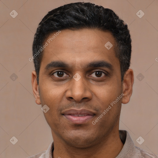 Joyful latino young-adult male with short  black hair and brown eyes