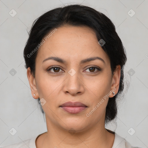 Joyful latino young-adult female with medium  black hair and brown eyes