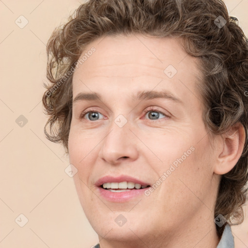 Joyful white young-adult female with medium  brown hair and green eyes