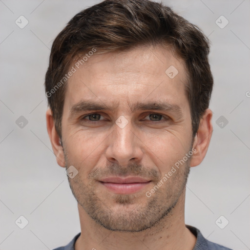 Joyful white adult male with short  brown hair and brown eyes