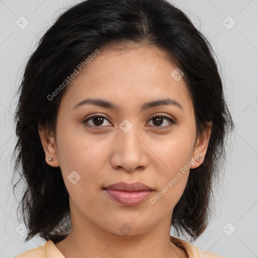 Joyful latino young-adult female with medium  brown hair and brown eyes