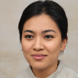 Joyful asian young-adult female with medium  brown hair and brown eyes