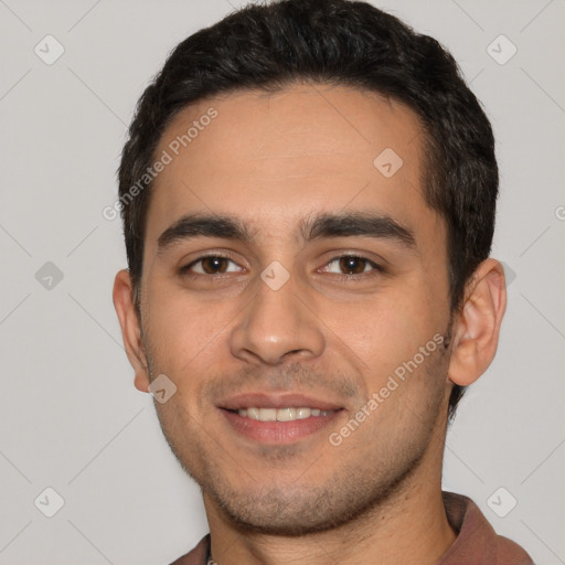 Joyful white young-adult male with short  black hair and brown eyes