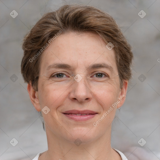 Joyful white adult female with short  brown hair and grey eyes