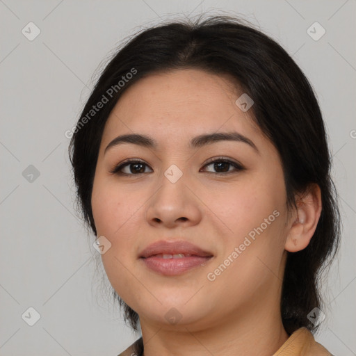 Joyful latino young-adult female with medium  brown hair and brown eyes