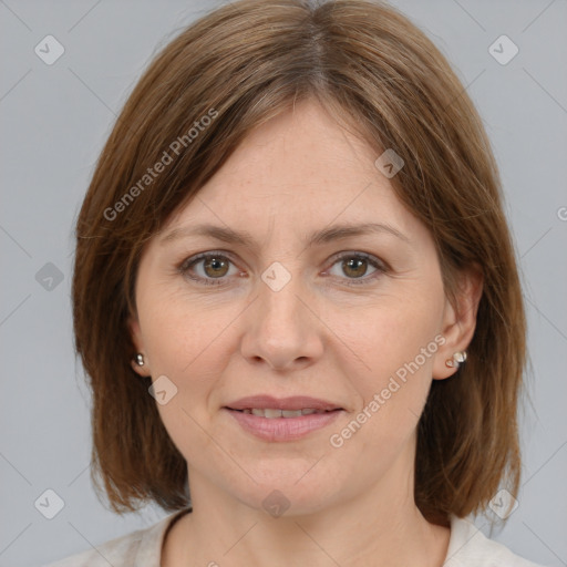 Joyful white adult female with medium  brown hair and grey eyes