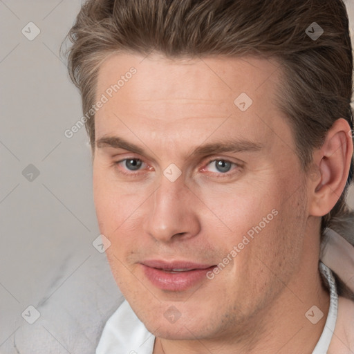 Joyful white adult male with short  brown hair and brown eyes