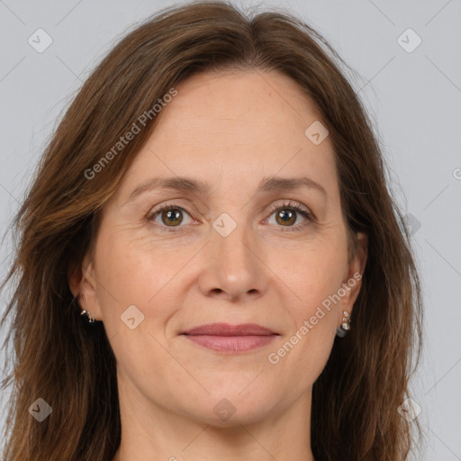 Joyful white adult female with long  brown hair and brown eyes