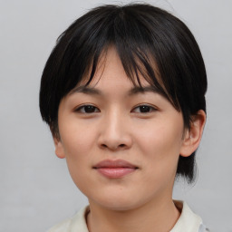 Joyful asian young-adult female with medium  brown hair and brown eyes