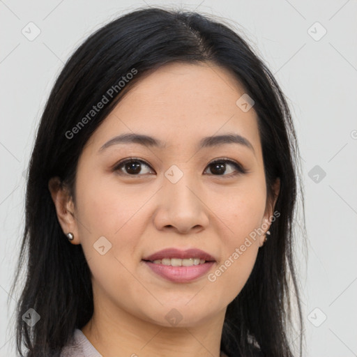 Joyful asian young-adult female with long  brown hair and brown eyes