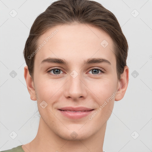 Joyful white young-adult female with short  brown hair and grey eyes