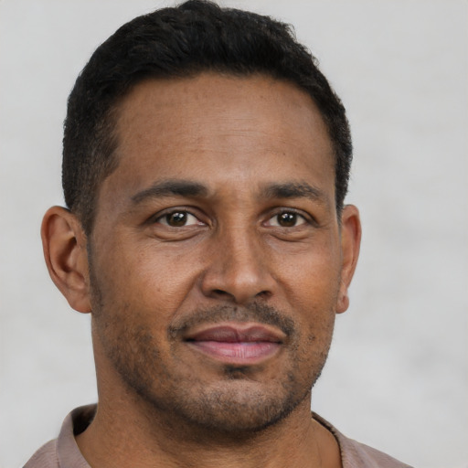 Neutral latino adult male with short  brown hair and brown eyes