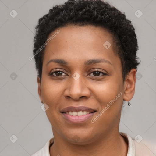 Joyful black young-adult female with short  brown hair and brown eyes