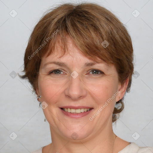 Joyful white adult female with medium  brown hair and grey eyes