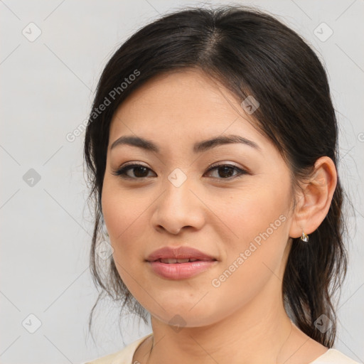 Joyful asian young-adult female with medium  brown hair and brown eyes