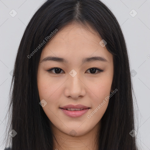 Joyful asian young-adult female with long  brown hair and brown eyes