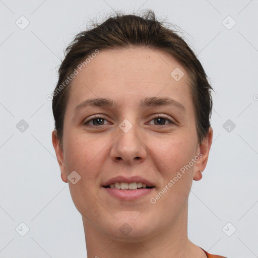 Joyful white young-adult female with short  brown hair and brown eyes