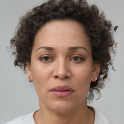 Joyful black adult female with short  brown hair and brown eyes