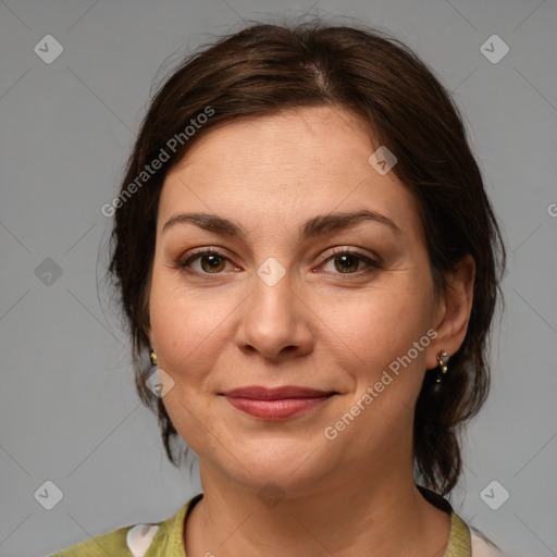 Joyful white adult female with medium  brown hair and brown eyes