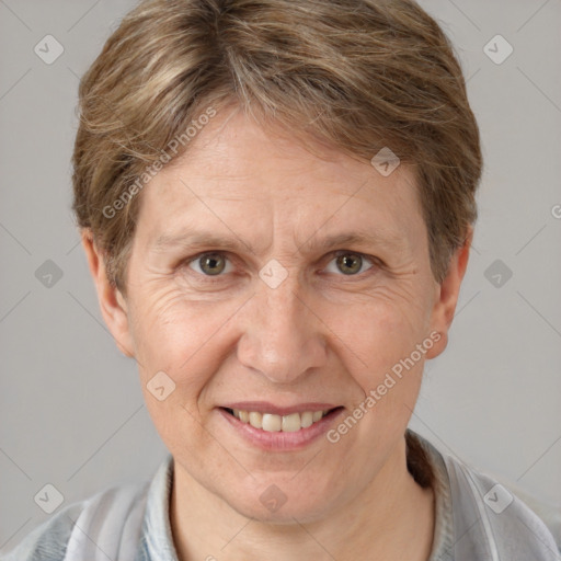 Joyful white adult female with short  brown hair and grey eyes