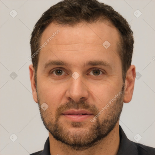 Joyful white adult male with short  brown hair and brown eyes