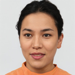 Joyful asian young-adult female with short  brown hair and brown eyes