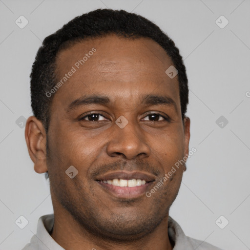 Joyful latino young-adult male with short  brown hair and brown eyes