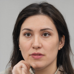 Joyful white adult female with medium  brown hair and brown eyes