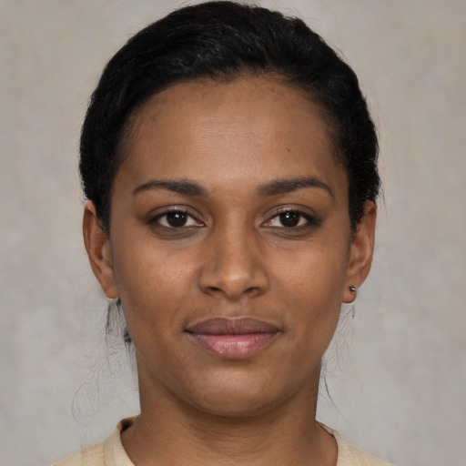 Joyful latino young-adult female with short  brown hair and brown eyes