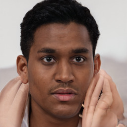 Neutral black young-adult male with short  brown hair and brown eyes