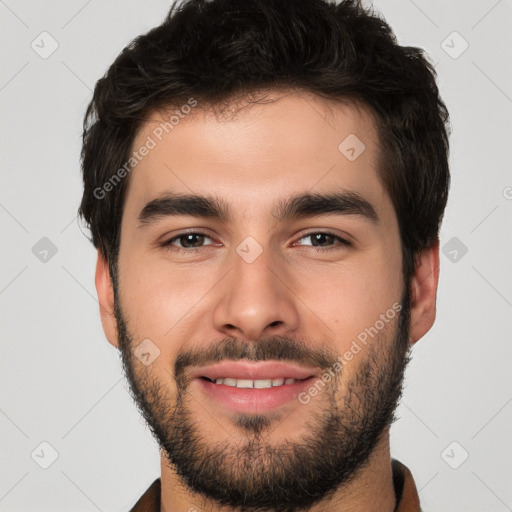 Joyful white young-adult male with short  black hair and brown eyes