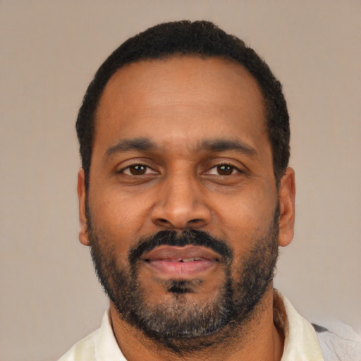 Neutral latino adult male with short  black hair and brown eyes