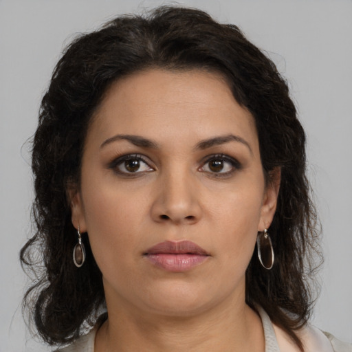Neutral latino young-adult female with medium  brown hair and brown eyes