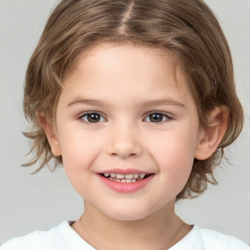 Joyful white child female with medium  brown hair and brown eyes