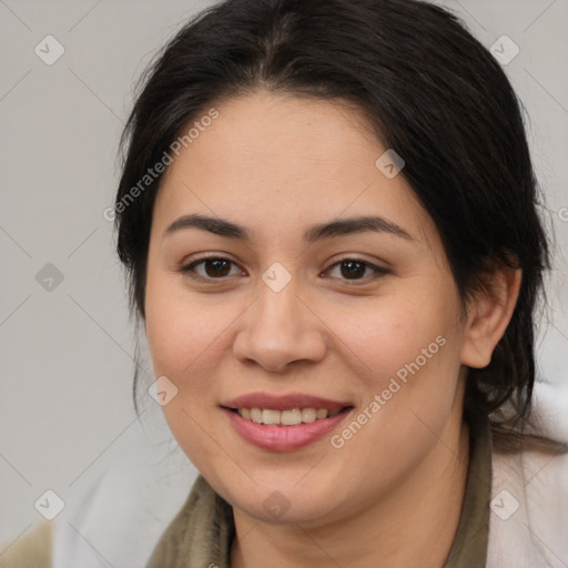 Joyful latino young-adult female with medium  brown hair and brown eyes