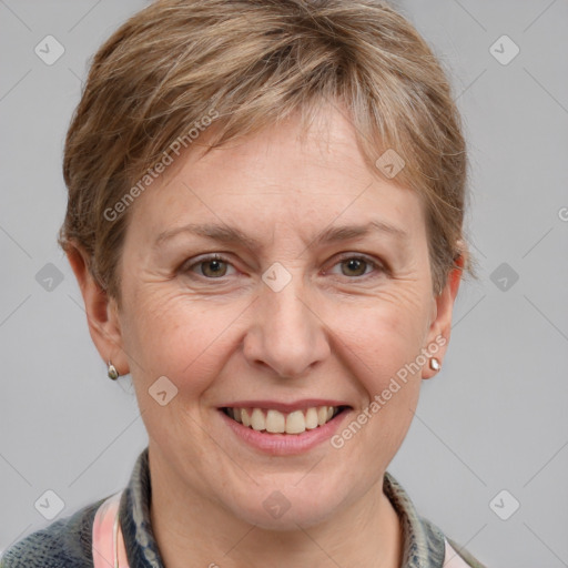 Joyful white adult female with short  brown hair and grey eyes