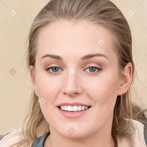 Joyful white young-adult female with medium  brown hair and blue eyes