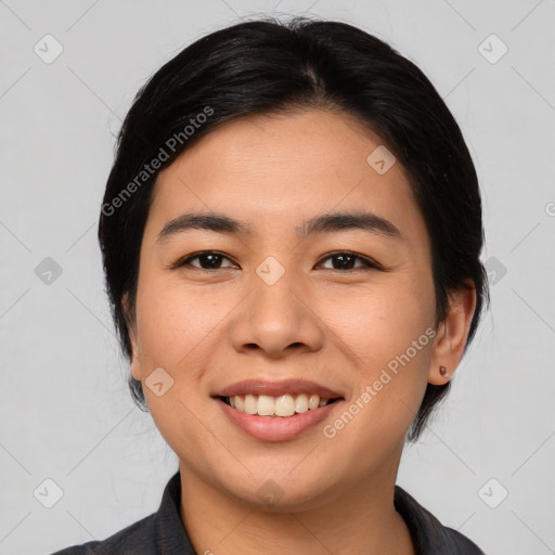 Joyful asian young-adult female with medium  black hair and brown eyes