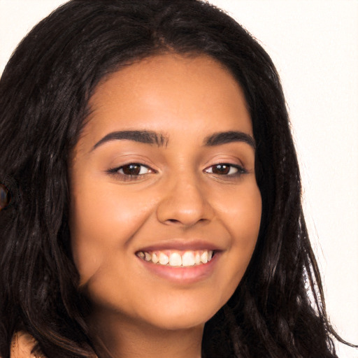 Joyful latino young-adult female with long  brown hair and brown eyes