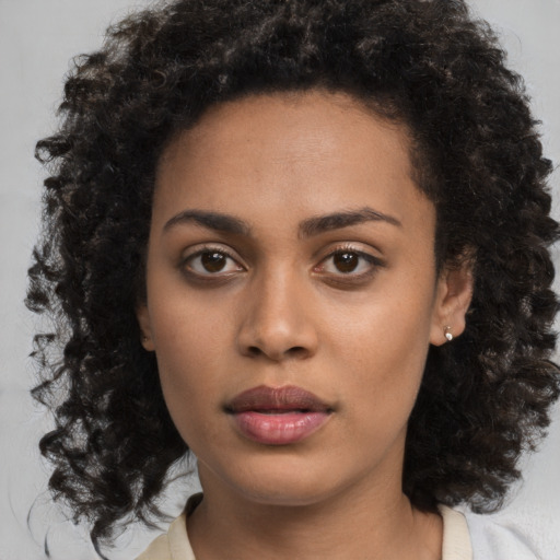 Neutral black young-adult female with medium  black hair and brown eyes